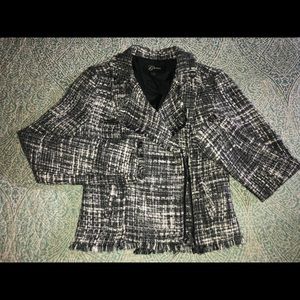 Grey blazer with white accents woven in.